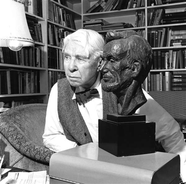 Carl Sandburg in his home in North Carolina with a bust of Lincoln in 1960.